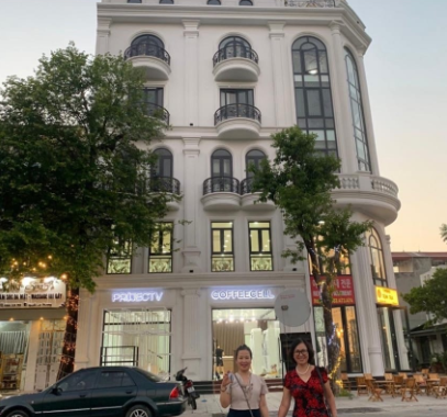 Girls in front of the new office in Viet Tri
