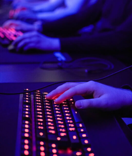 A gamer’s hand on the keyboard