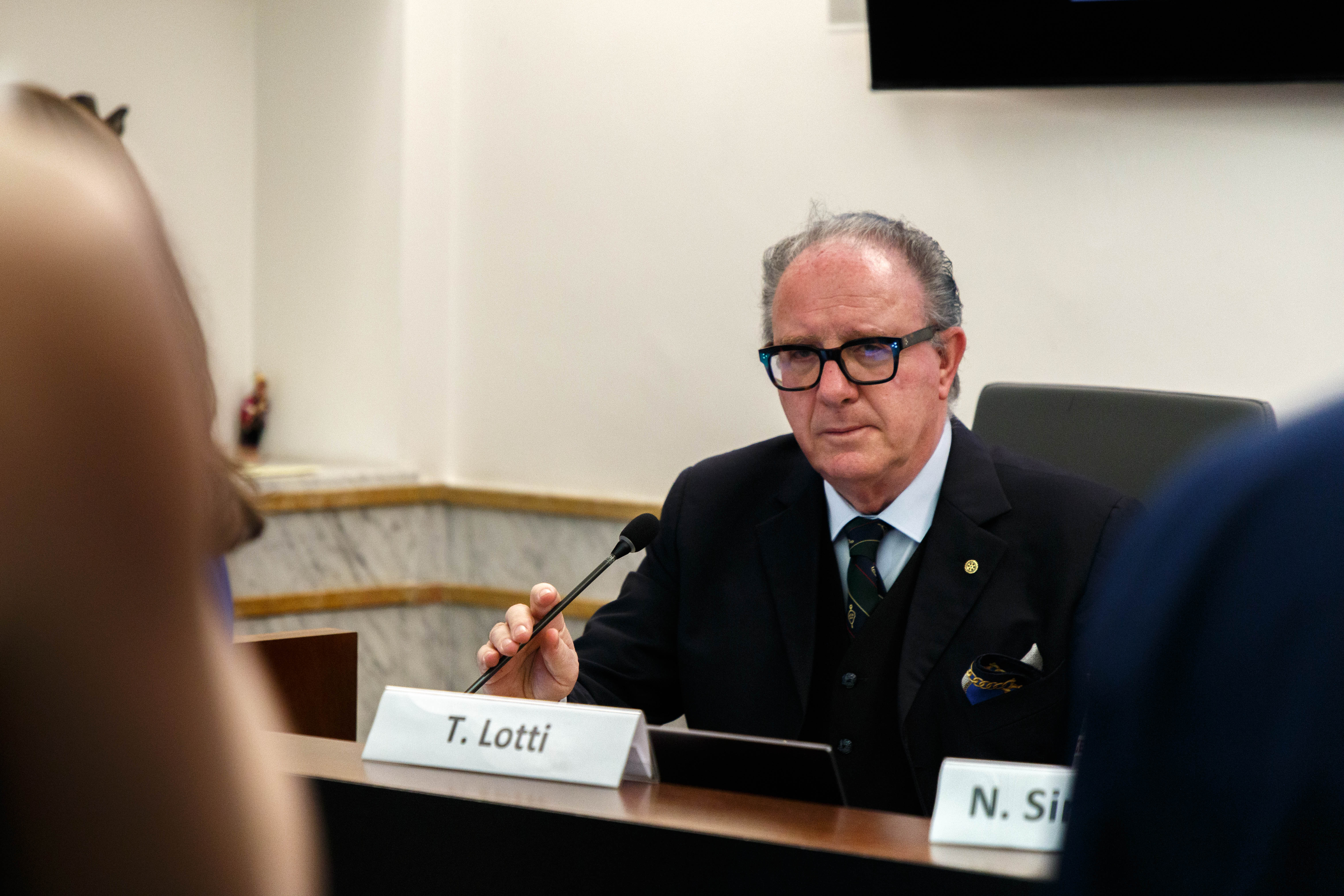 Torello Lotti is holding the microphone
