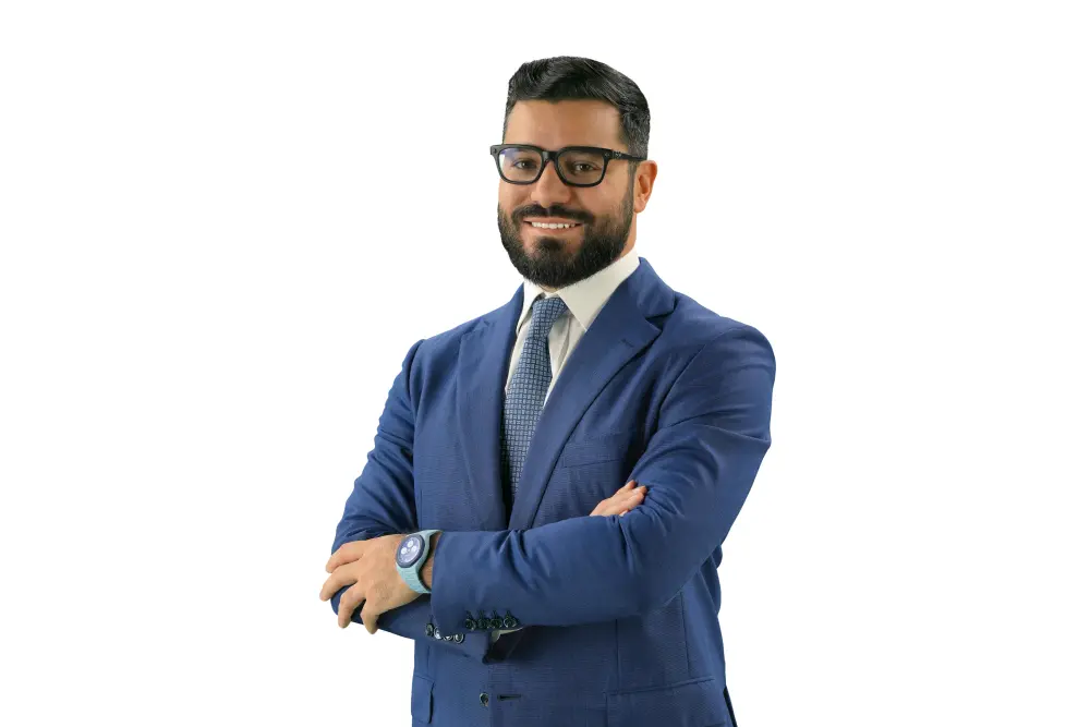 Narek in a blue suit smiles