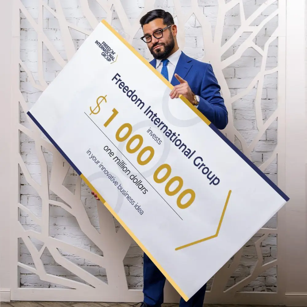 Narek in a blue suit with a certificate