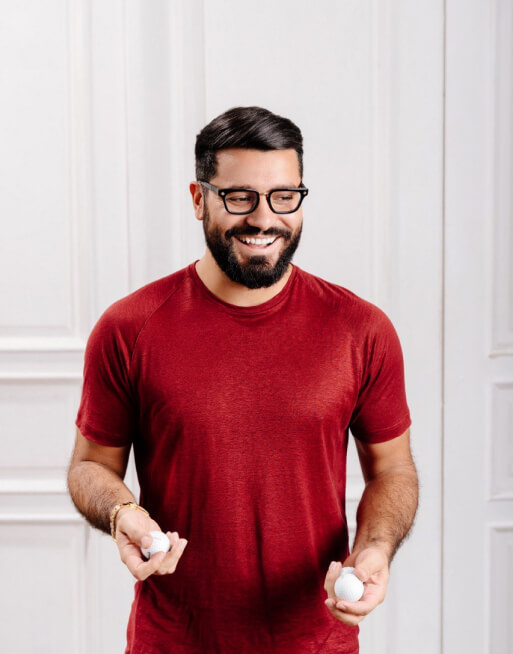 Narek in a red t-shirt with ping-pong balls