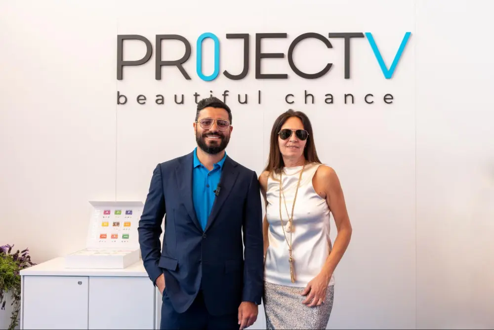 Narek smiling in a dark blue suit at Monte-Carlo Fashion Week 2025