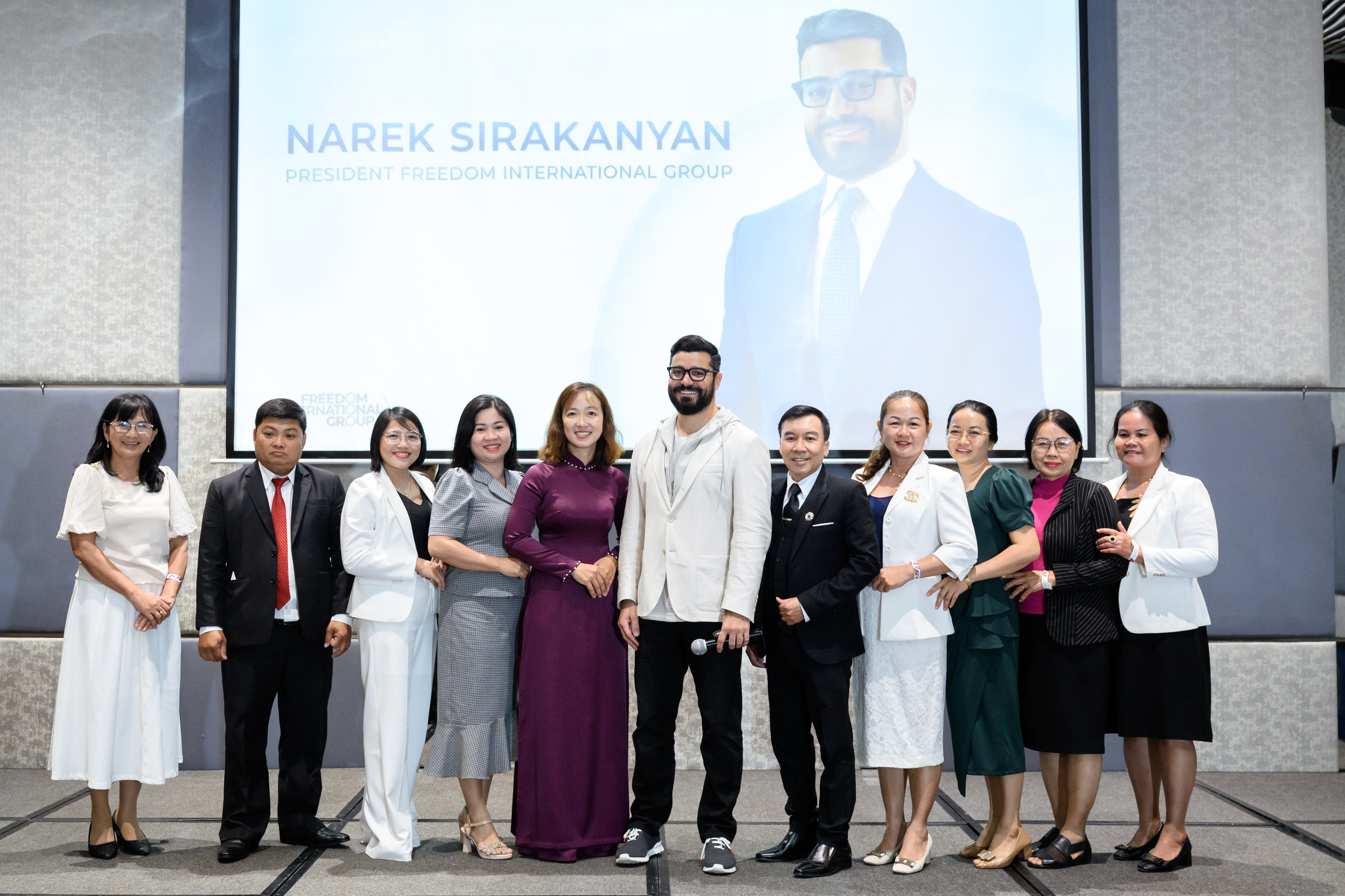 Narek is standing with the participants in Vietnam