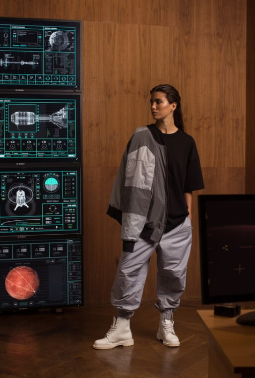 A woman in a gray NRK87 suit