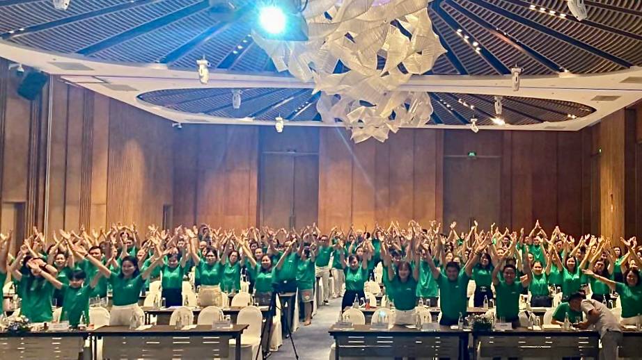 Participants in green t-shirts in Vietnam